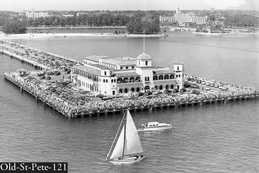 Black and white aerial photo of sailboat and million dollar pier